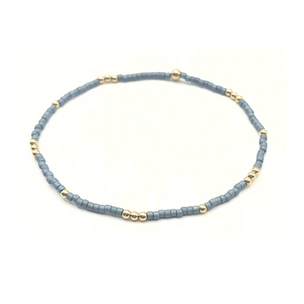 Gold-filled beaded bracelet with blue beads and gold accents 