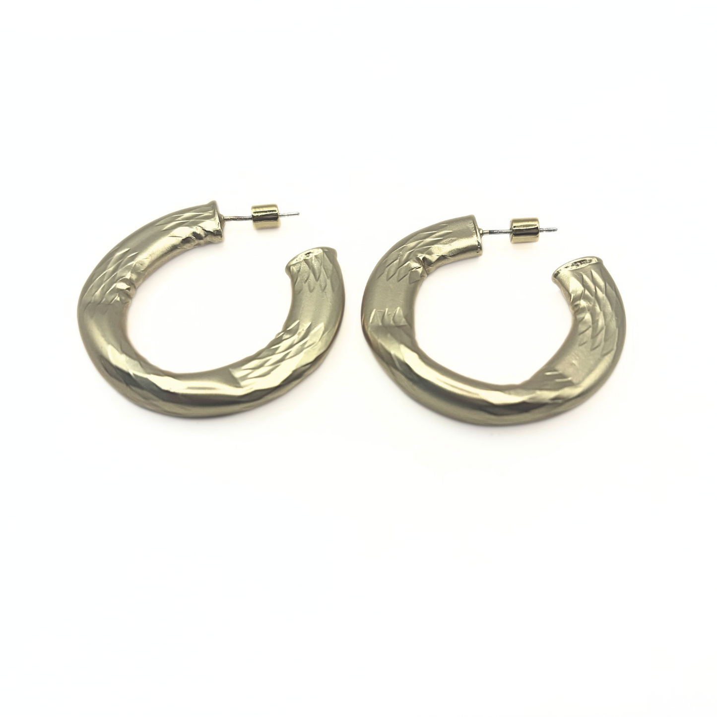 Gold hoop earrings on a white background