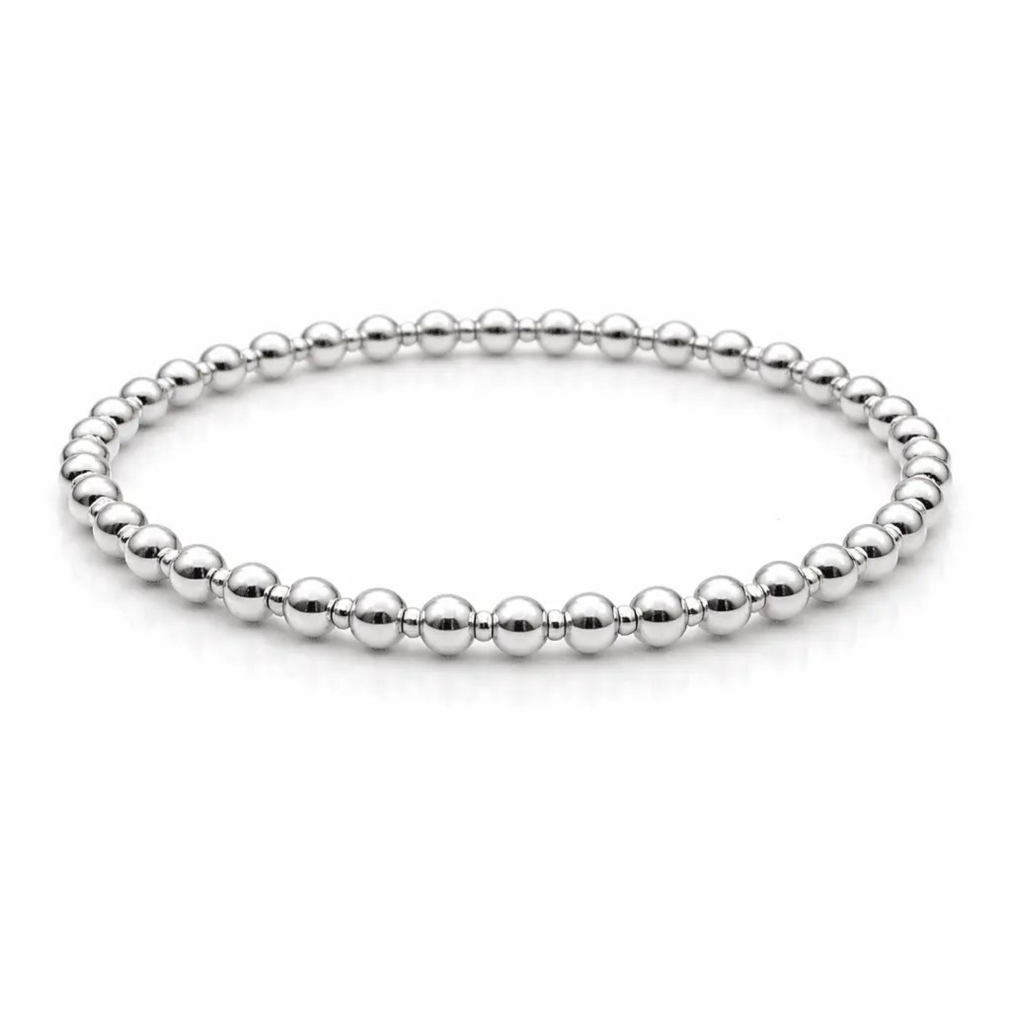 Sterling silver waterproof beaded bracelet with 4mm and 2mm beads by Erin Gray, showcasing a sleek, layered jewelry design.