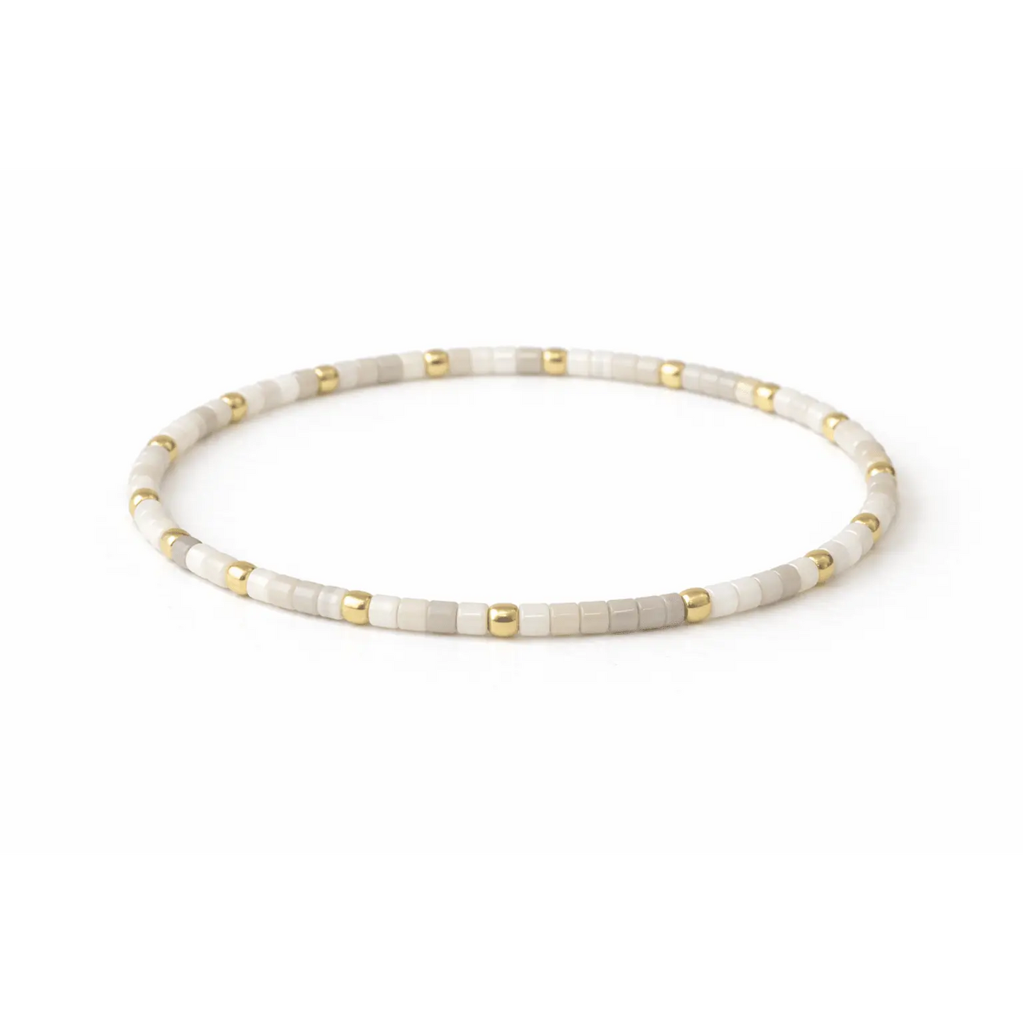 Endless Summer 14k gold-filled beaded bracelet by Erin Gray featuring white beads and a delicate, stylish jewelry design.