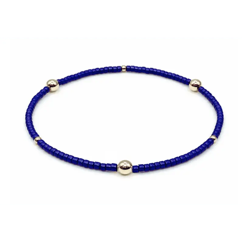 Blue and gold filled Game Day bracelet by Erin Gray, featuring layered jewelry design and vibrant team colors.