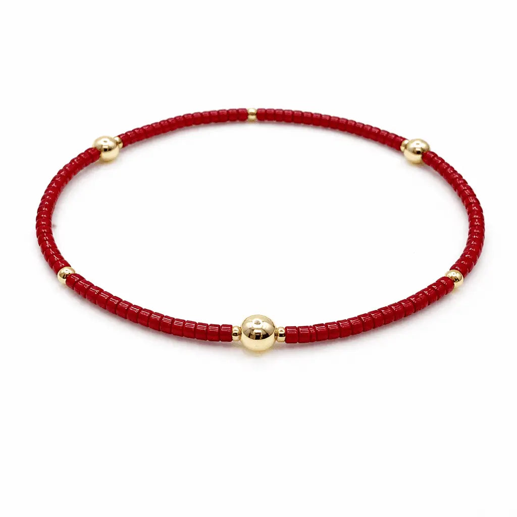 Crimson and gold filled bracelet from Erin Gray's Game Day jewelry collection, featuring elegant layered design.