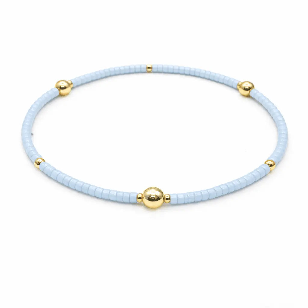 Light blue and gold filled bracelet from erin gray's Game Day jewelry collection, featuring elegant, layered design.
