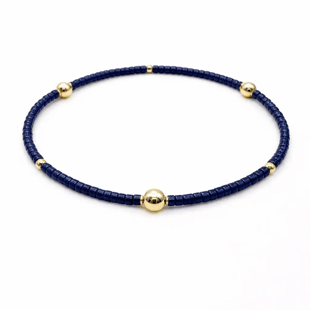 Navy and gold filled bracelet from erin gray, stylish jewelry accessory with intricate design and smooth finish.