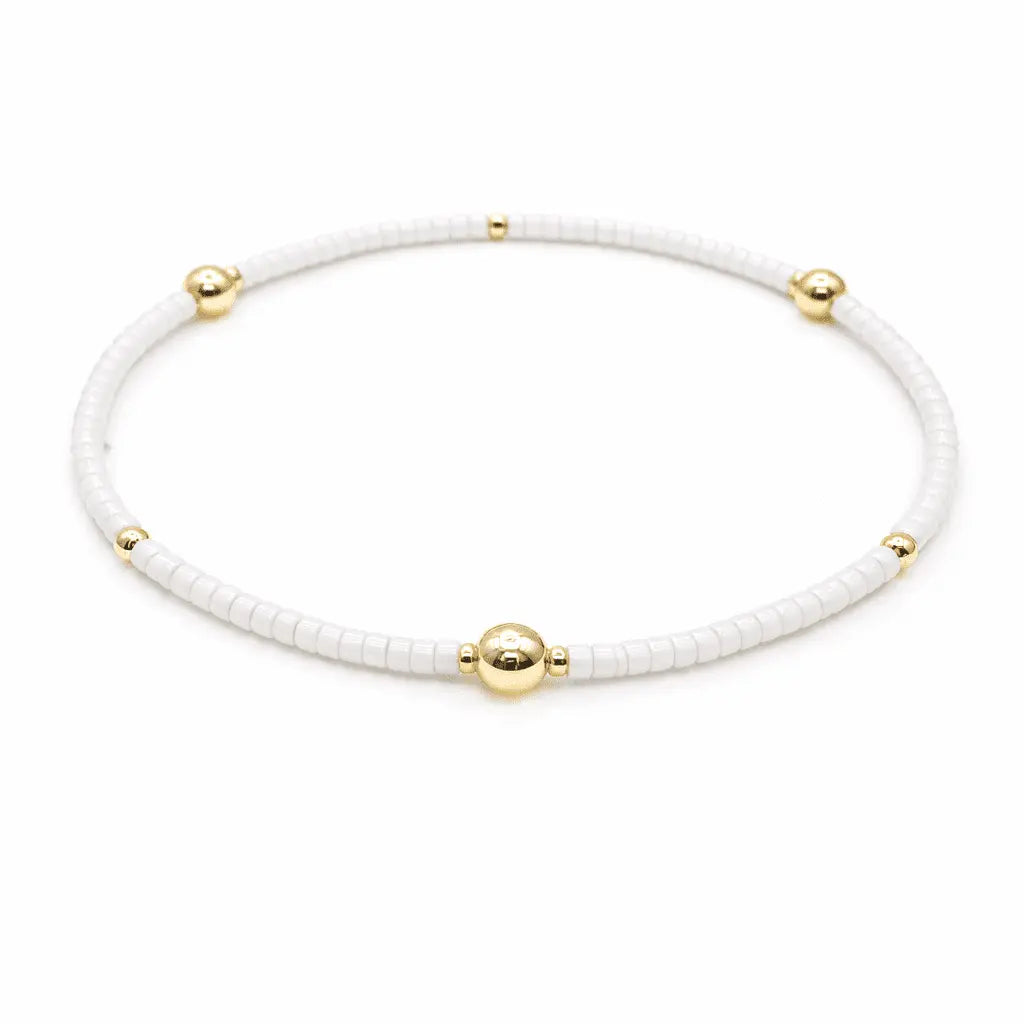 White and gold filled jewelry bracelet with "Game Day" charm by erin gray, featuring a stylish and sporty design.