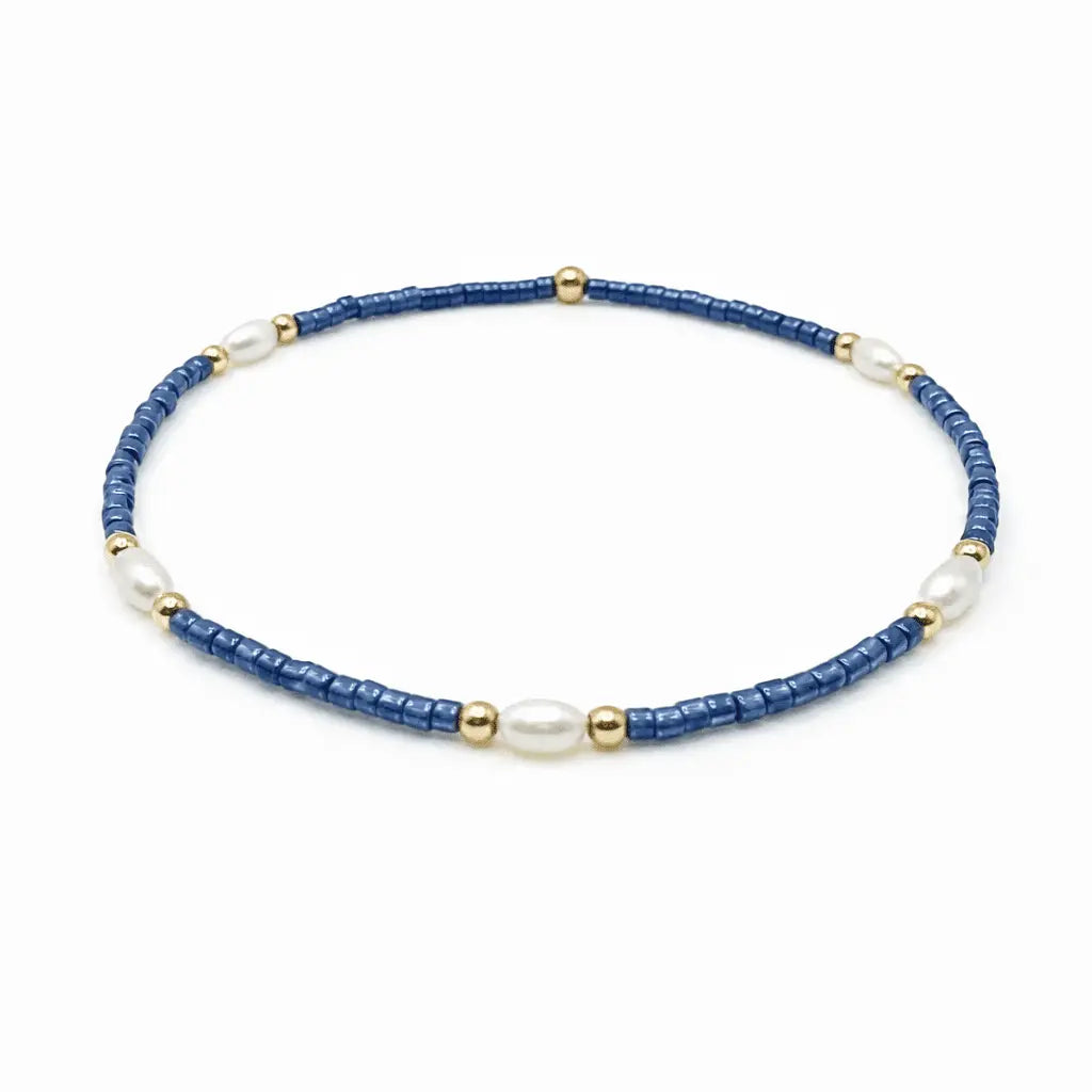 Blue and gold waterproof jewelry bracelets by erin gray featuring pearl accents, perfect for game day accessories.