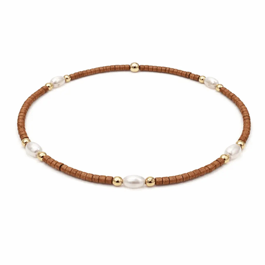Burnt orange and gold waterproof jewelry bracelets with pearl accents by erin gray, designed for game day accessories.