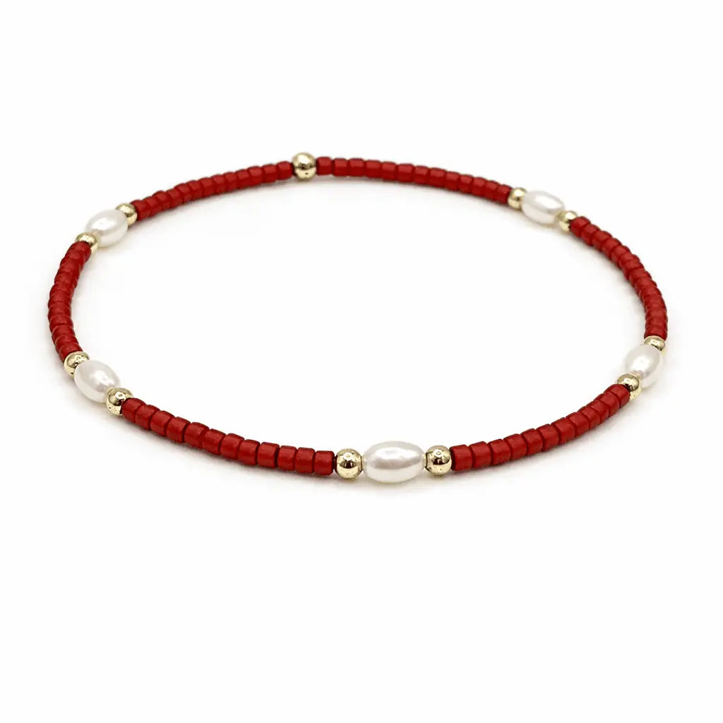 Elegant Erin Gray jewelry bracelet featuring pearl, crimson, and gold-filled waterproof design for stylish game day accessories.