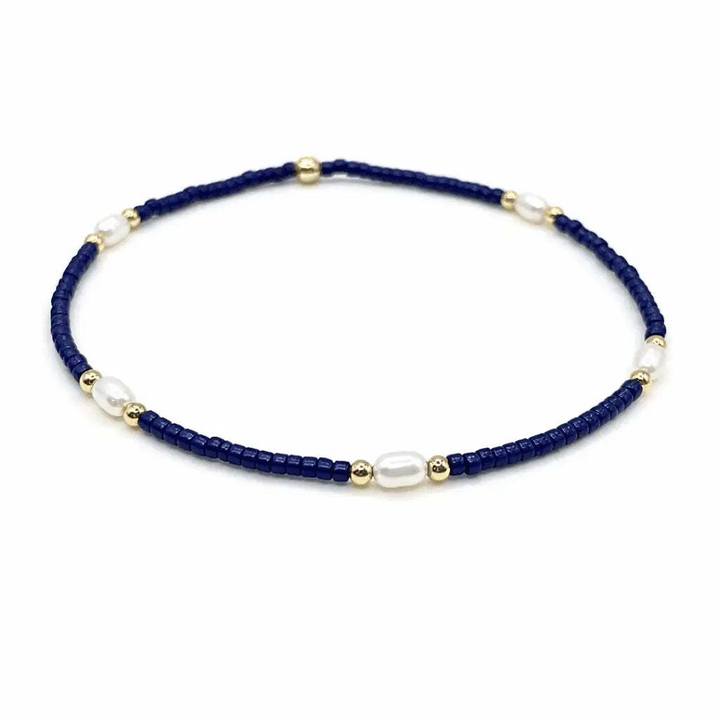 Pearl, navy, and gold-filled waterproof bracelets from erin gray's Game Day jewelry collection, featuring stylish, durable design.