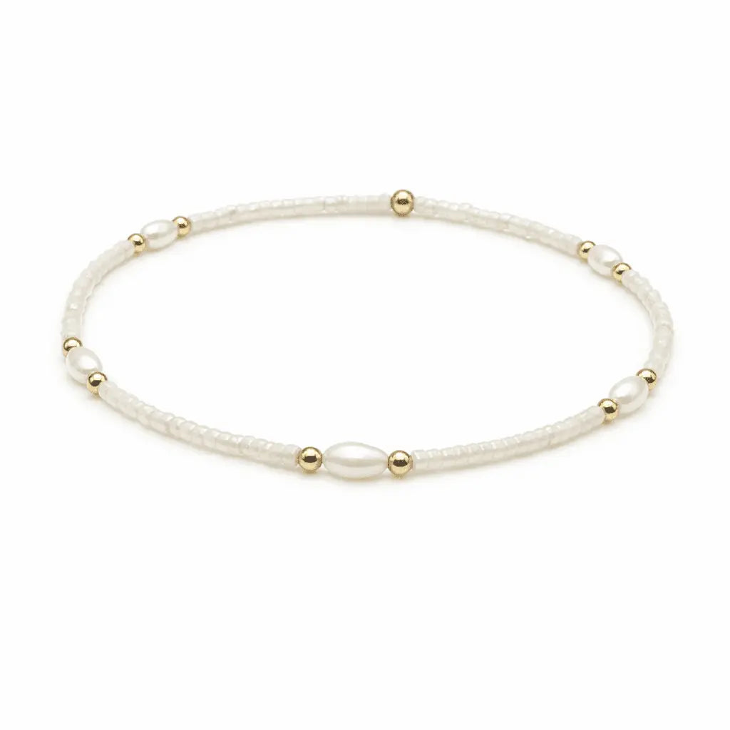 White and gold-filled waterproof jewelry bracelets with pearl accents from erin gray's Game Day collection.