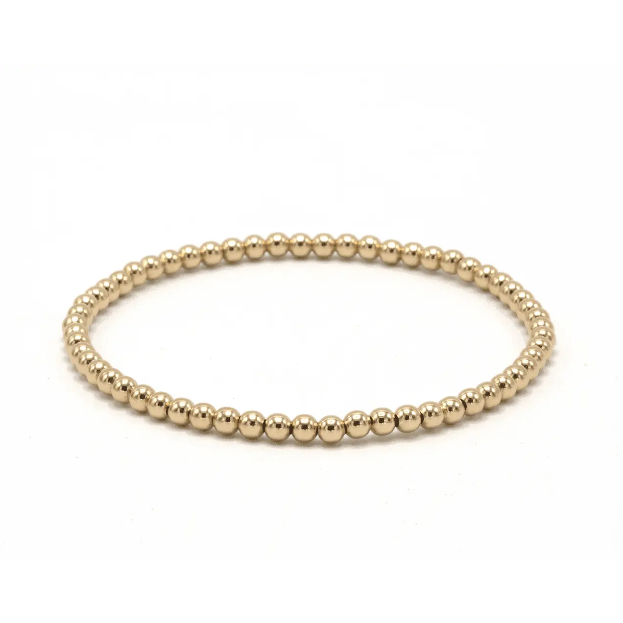 Gold filled 3mm Karma waterproof bracelet by Erin Gray, showcasing its sleek design and durable jewelry construction.