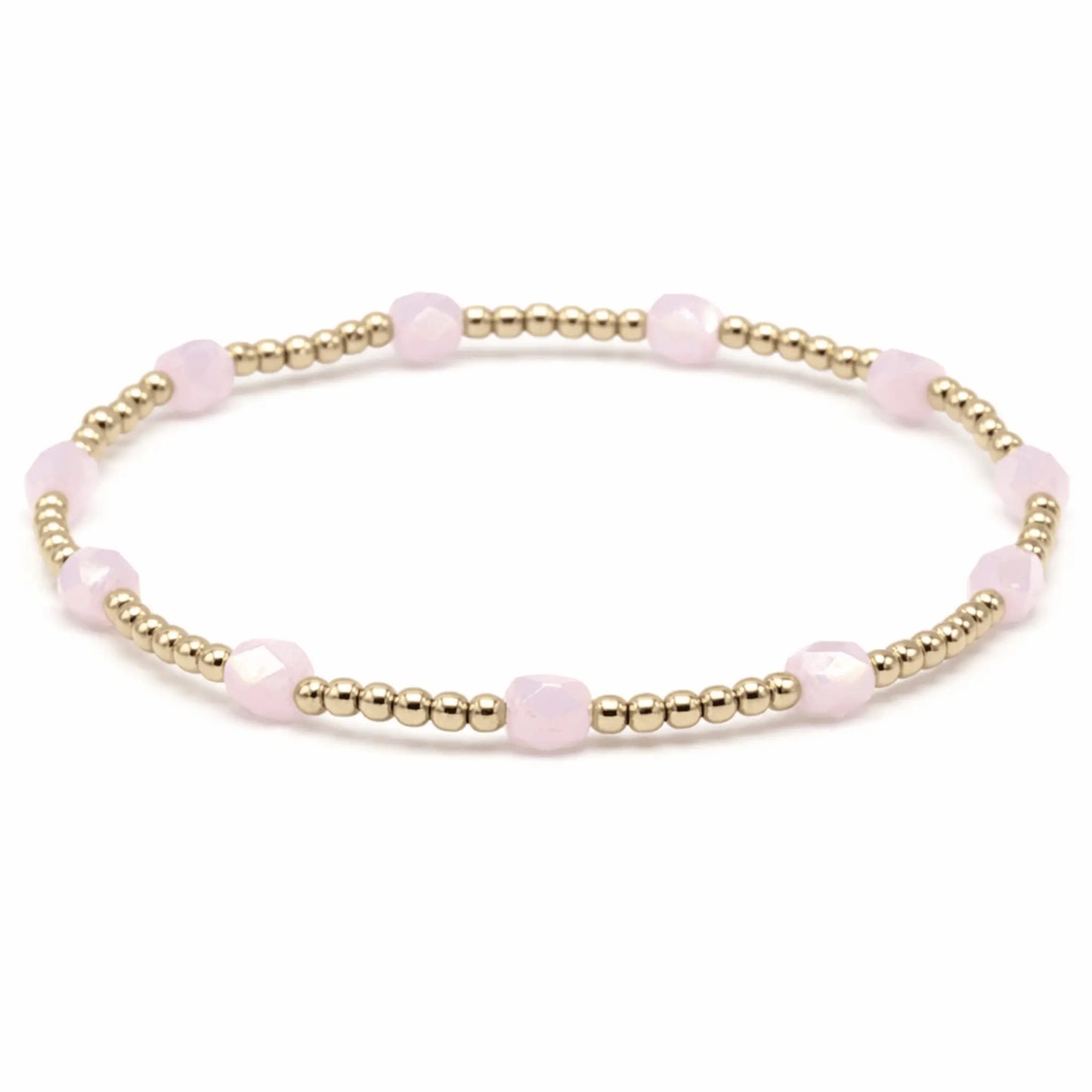 Light pink Key West bracelet by erin gray, delicate jewelry piece with a subtle, elegant design featuring beads and a charm.