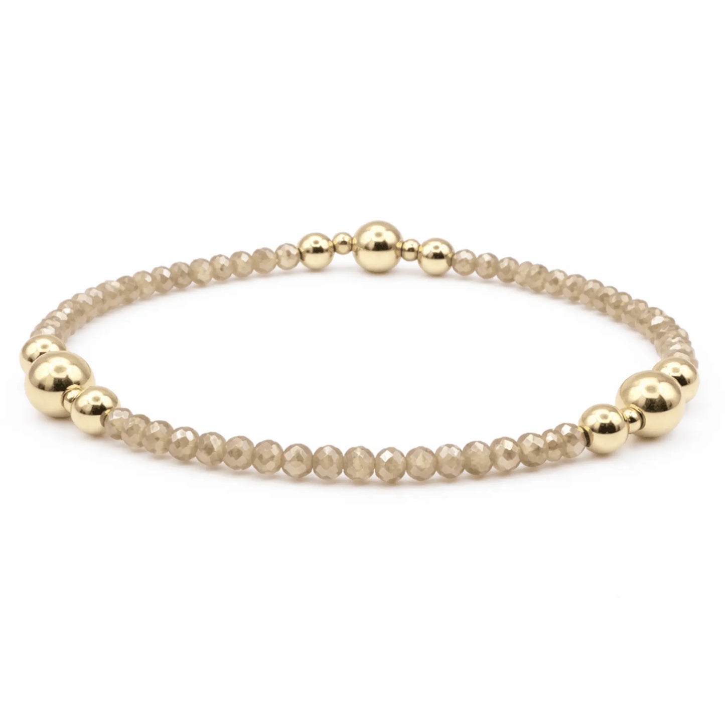 Gold filled beaded bracelet from erin gray featuring shimmering champagne-colored beads, stylish jewelry accessory.