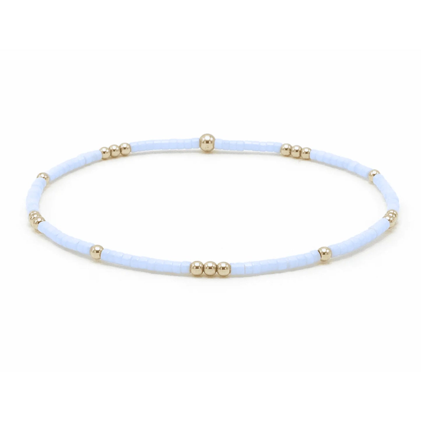Blue gray and gold-filled waterproof bracelet by erin gray featuring delicate jewelry design and diamond charm accents.