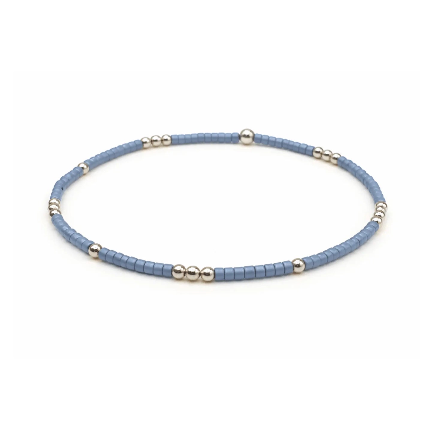 Blue denim and gold-filled waterproof bracelet by erin gray, featuring a stylish jewelry design with diamond charm accents.