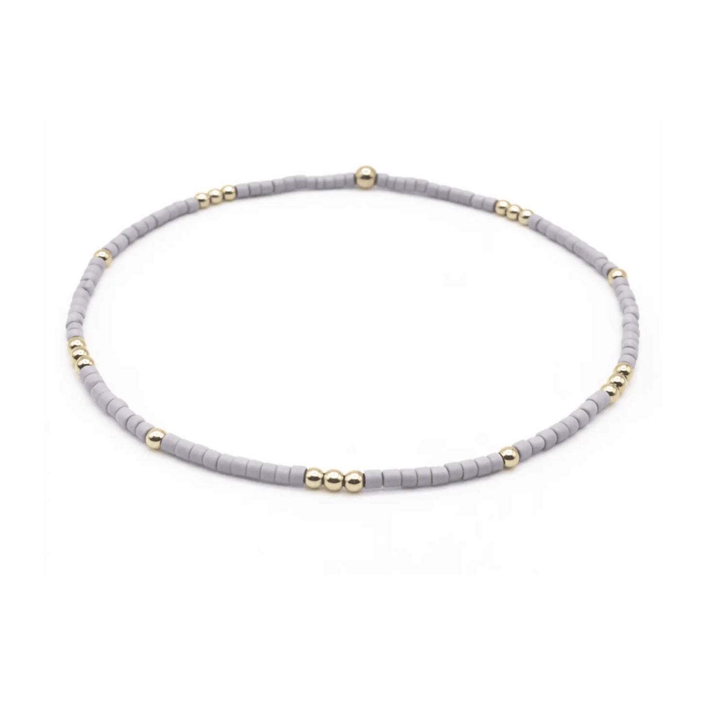 Lavender and gold-filled waterproof bracelet by erin gray featuring delicate jewelry charms on a sleek design.