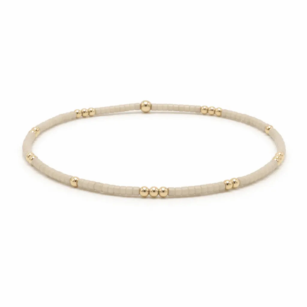 Minimalist 2mm Newport Oyster gold-filled waterproof bracelet by Erin Gray featuring sleek design and durable craftsmanship.