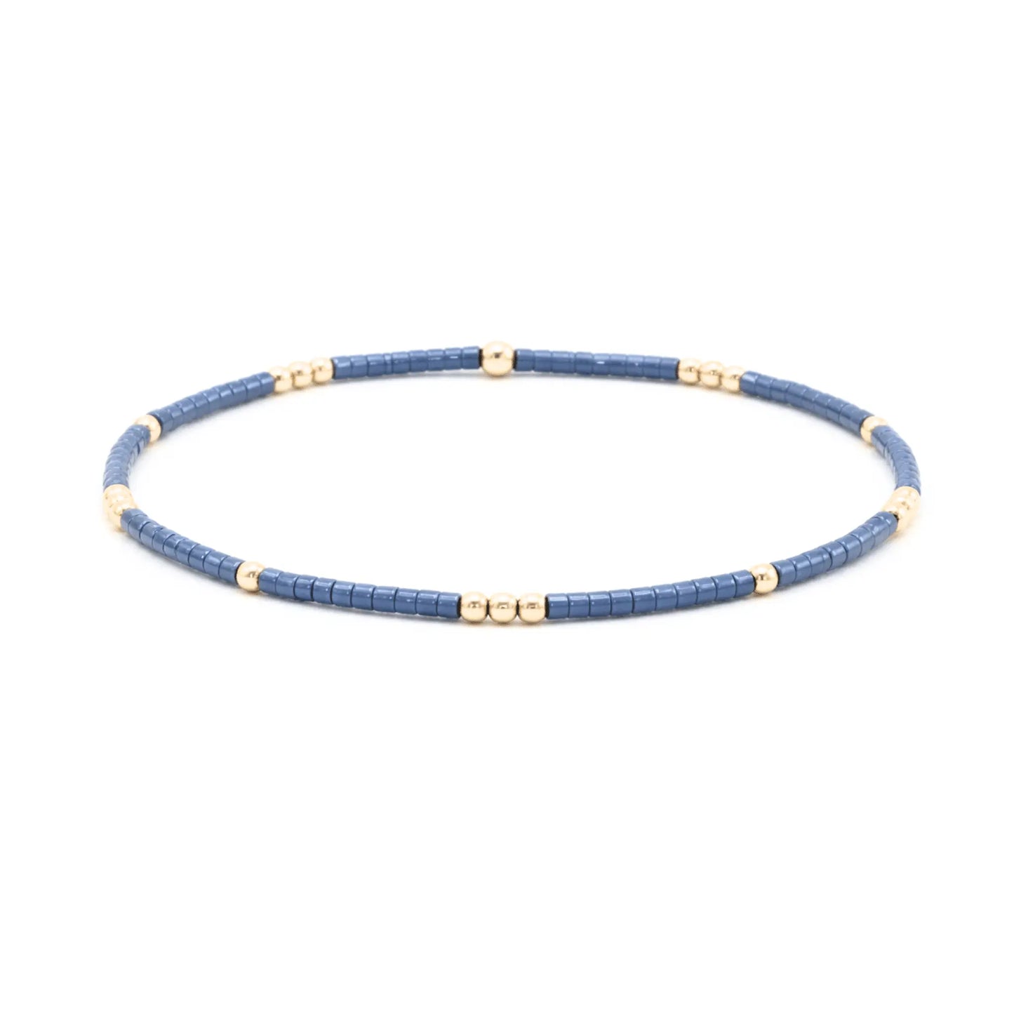 Steel blue and gold-filled waterproof bracelet by Erin Gray featuring diamond charms, crafted jewelry with elegant design.