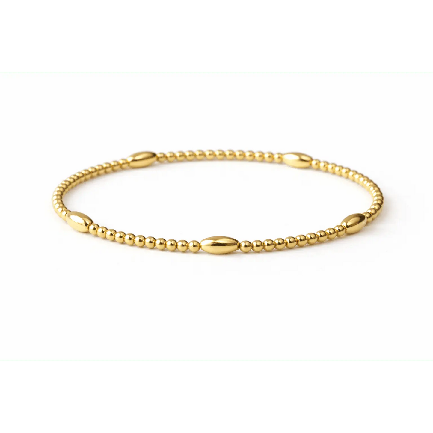 Gold-filled beaded and oval stretch bracelet by Erin Gray, featuring a classic all-gold jewelry design.