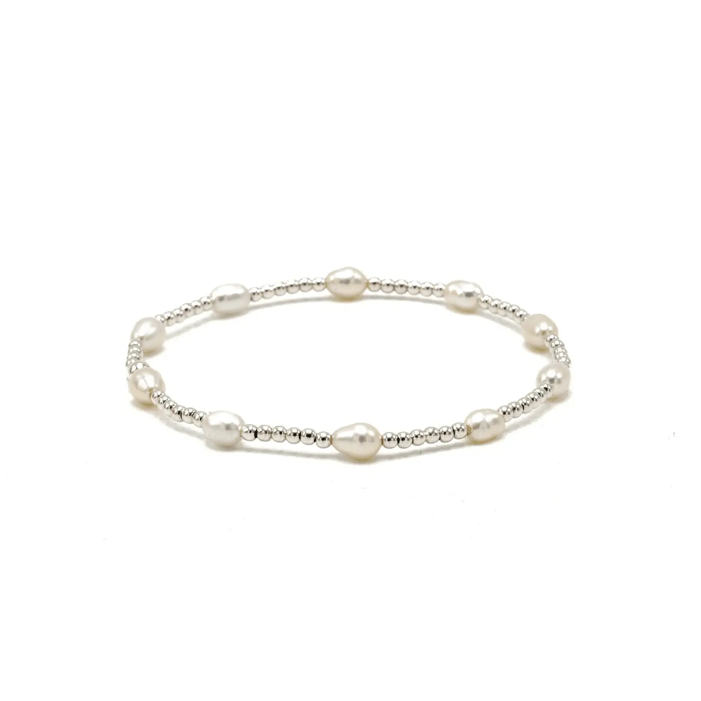 Petite patterned rice pearl bracelet by erin gray featuring sterling silver beads and delicate jewelry design.