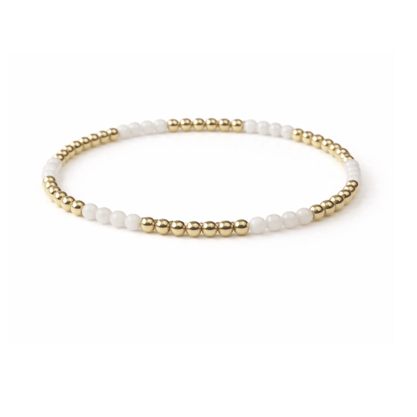 Refined white stone and 14k gold-filled beaded bracelet by Erin Gray, showcasing elegant jewelry design and craftsmanship.