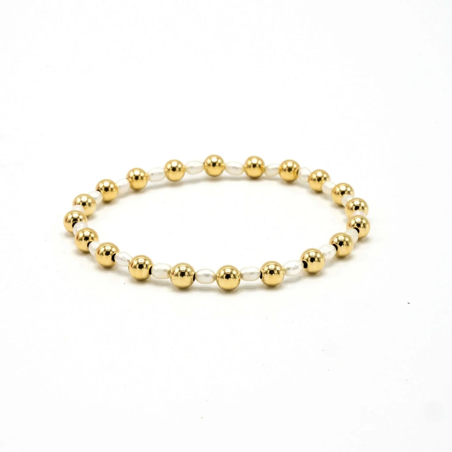 14k gold and pearl waterproof bracelet with 5mm Montauk beads by erin gray, featuring elegant jewelry design and craftsmanship.