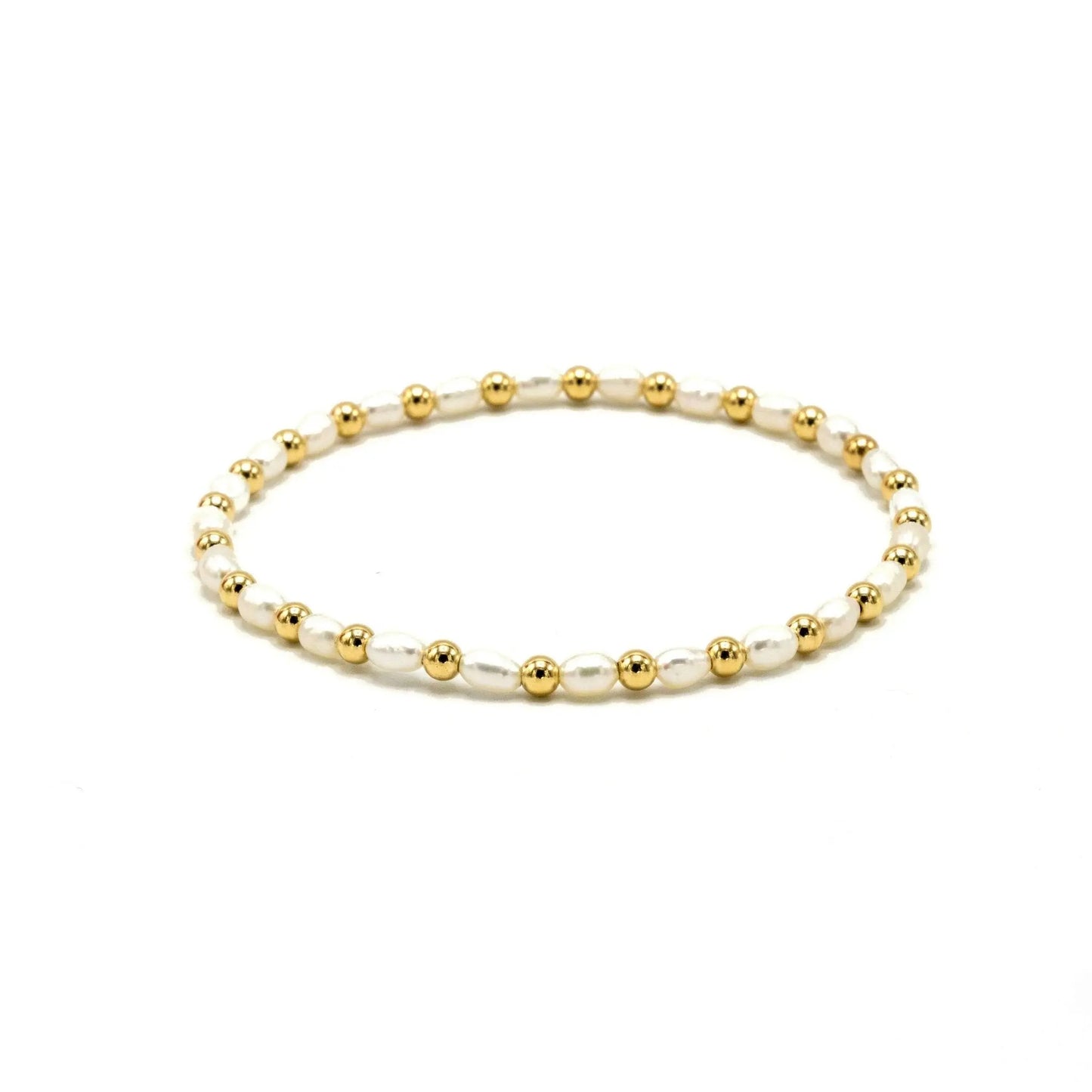 14k gold and pearl waterproof bracelet with 3mm Montauk beads by Erin Gray, close-up view of jewelry design.