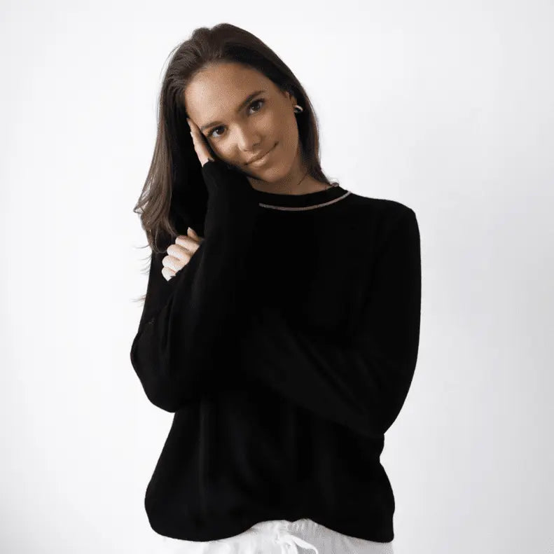 Black and beige Highland Raw Edge Mongolian cashmere sweater by erin gray, featuring a cozy, soft knit design.