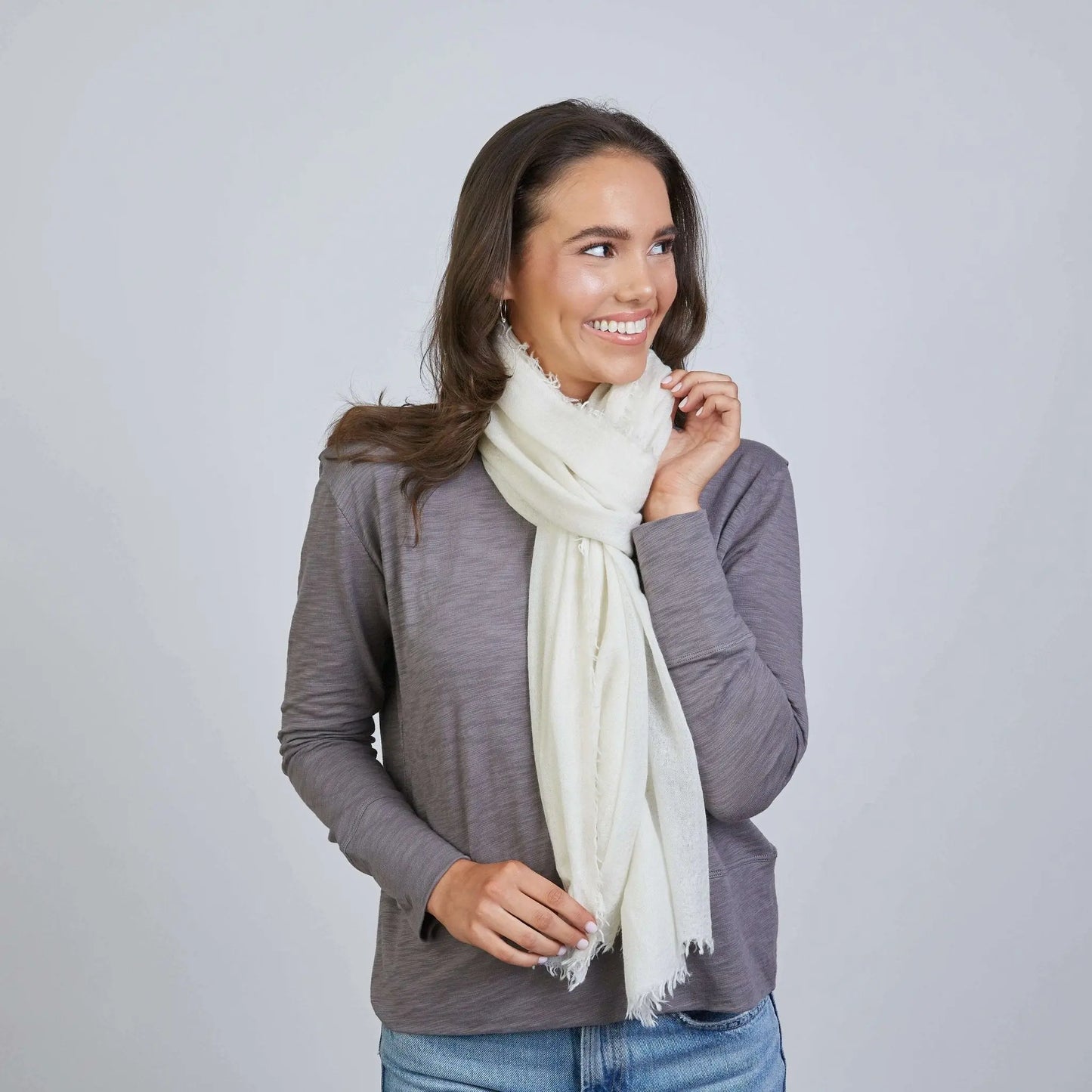 Ivory Mongolian cashmere scarf by erin gray, soft and luxurious with a lightweight, elegant drape, perfect for cold weather.