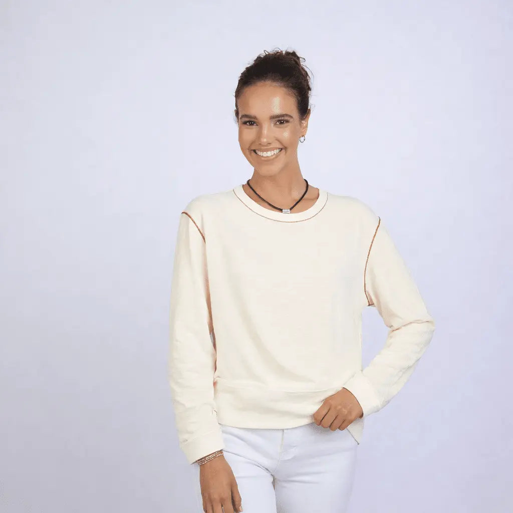 Erin Gray Riviera Slub Tee in ivory with red stitching, long sleeve casual apparel, shown on a model.