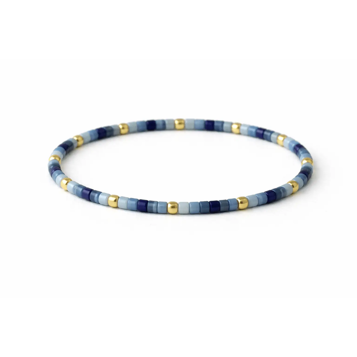 Endless Summer 14k gold-filled and blue beaded bracelet by Erin Gray, featuring alternating gold and blue beads on a delicate jewelry piece.