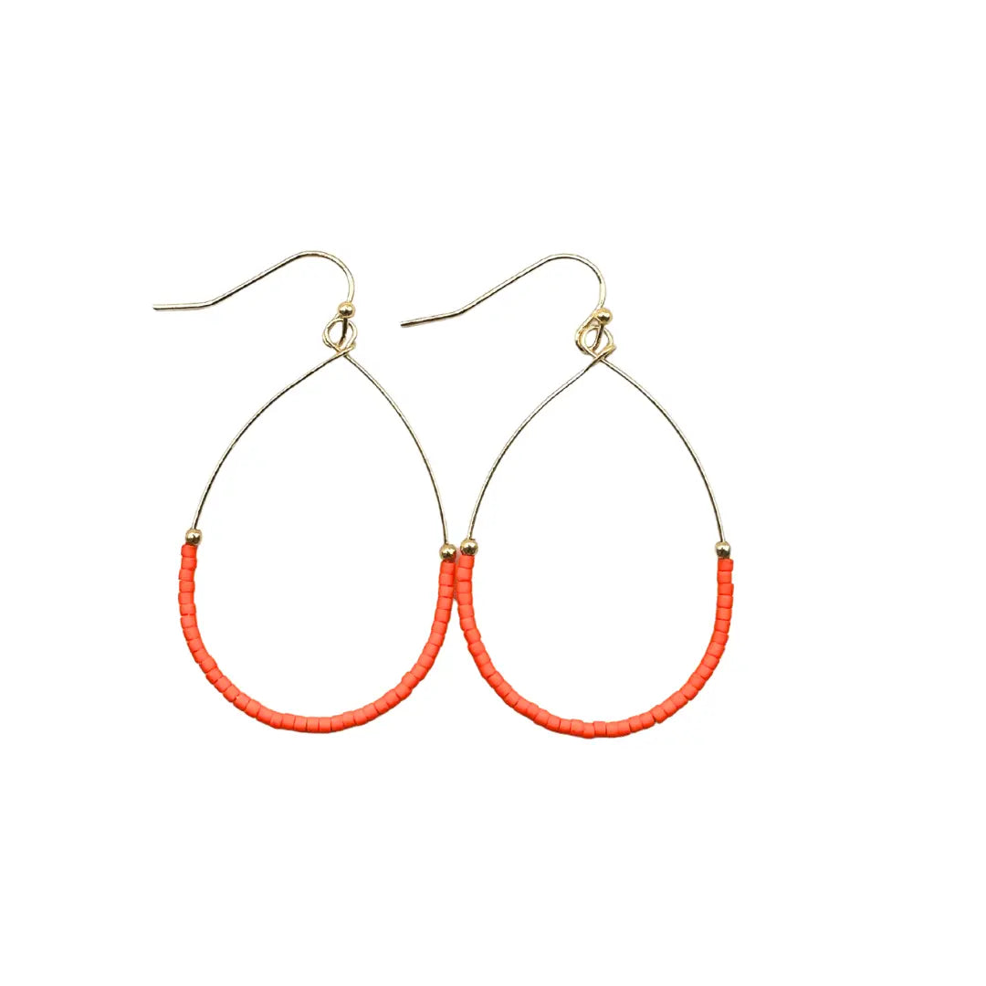 Orange Aster Game Day earrings by erin gray, lightweight jewelry featuring vibrant orange floral design on gold-tone hooks.