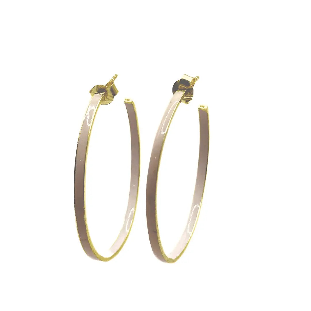 Enameled hoop earrings by Erin Gray featuring colorful, glossy enamel finish on medium-sized gold-tone hoops.