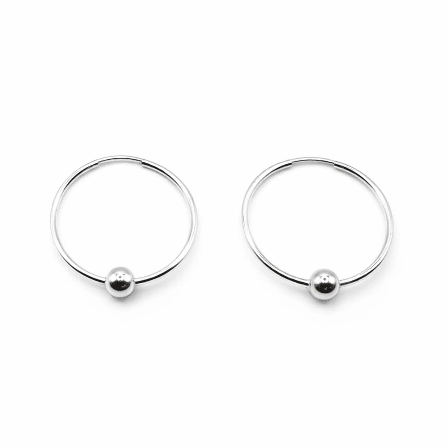 Sterling silver endless hoop earrings by Erin Gray, featuring sleek single sterling design on classic hoop jewelry.