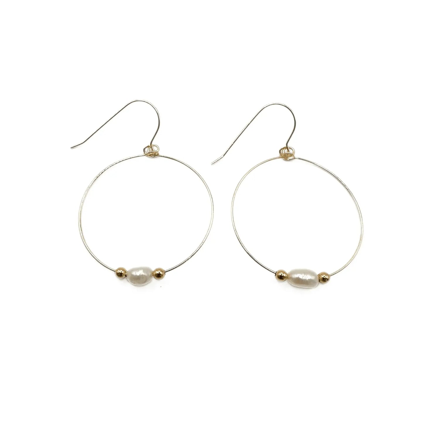 Gold filled rice pearl hoop danglers by Erin Gray featuring simple waterproof design, perfect for elegant jewelry style.