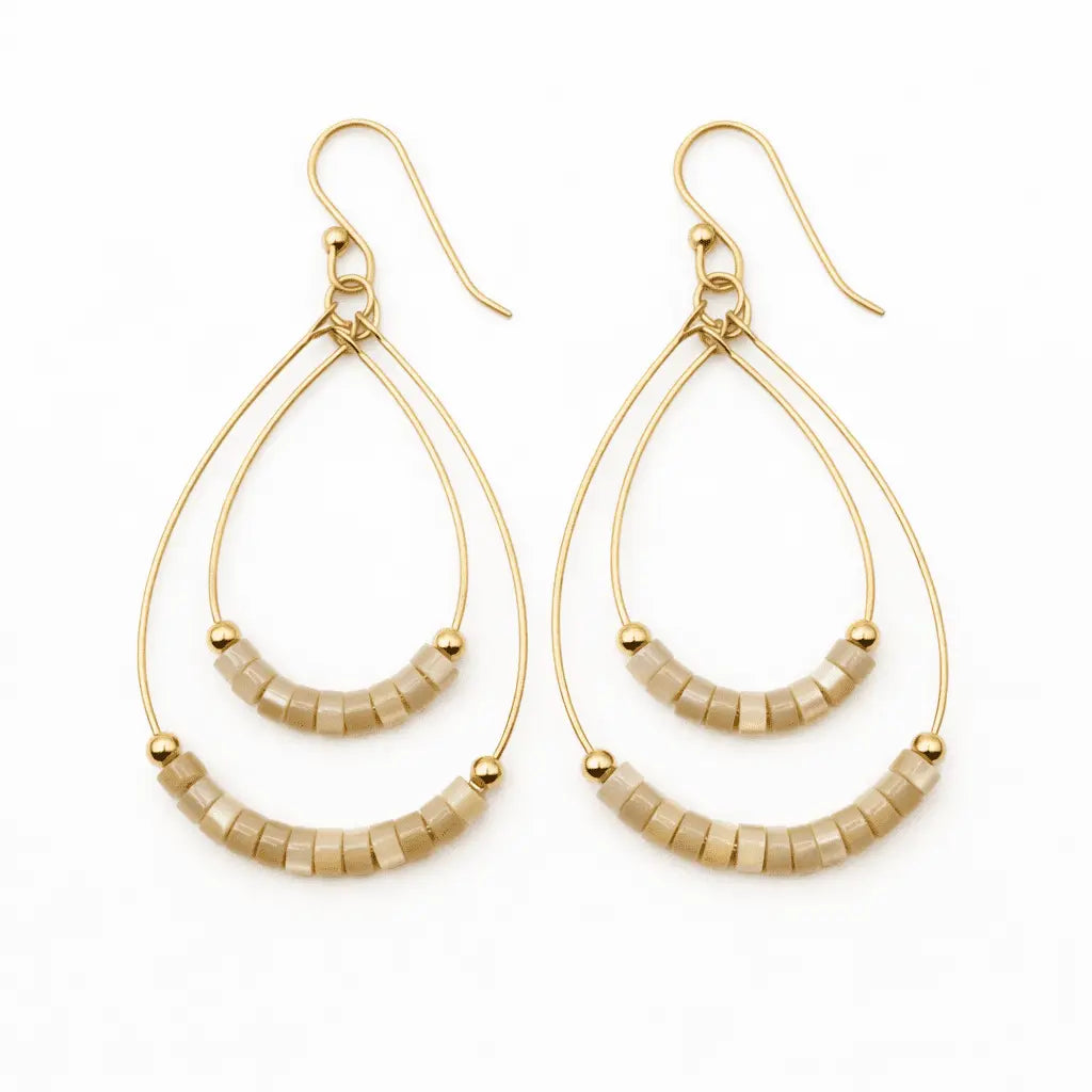 Natural Heishi Ella Cate earrings by erin gray featuring small, round, layered bead design in natural tones for stylish jewelry.