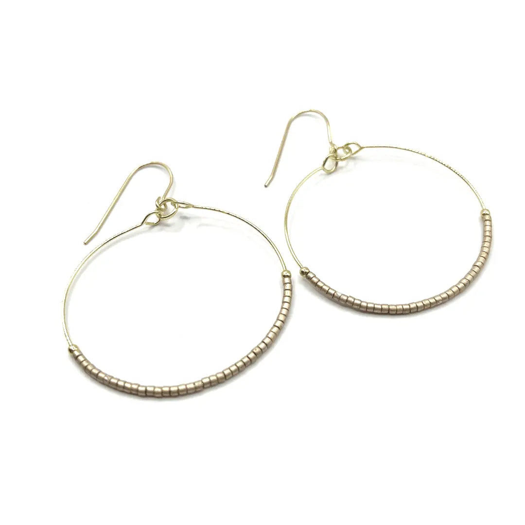 Golden Hollywood Hoop earrings by Erin Gray, elegant jewelry featuring large, shiny hoop design in gold finish.