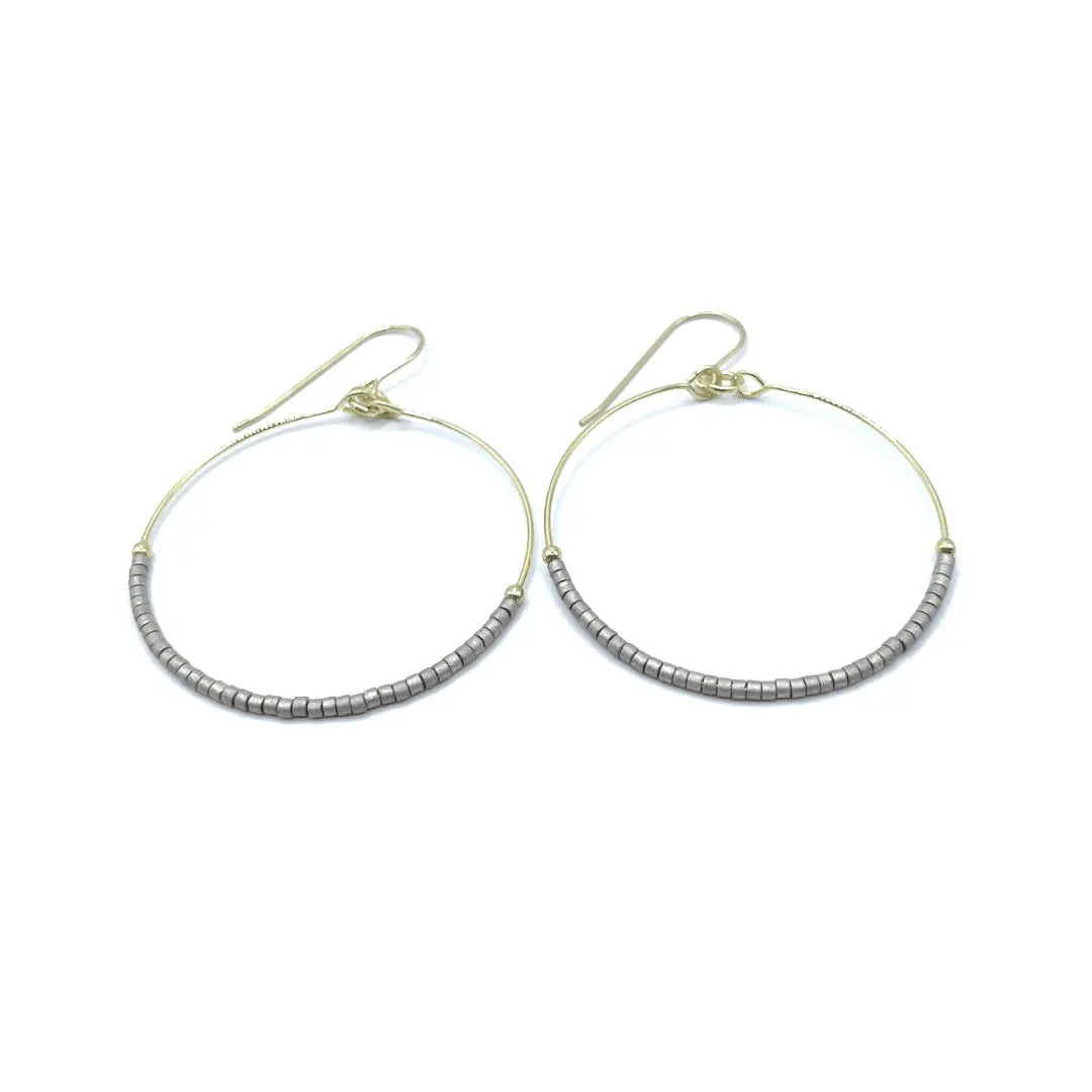 Erin Gray Hollywood Hoop earrings in pewter, showcasing large circular metal jewelry with a smooth finish and modern style