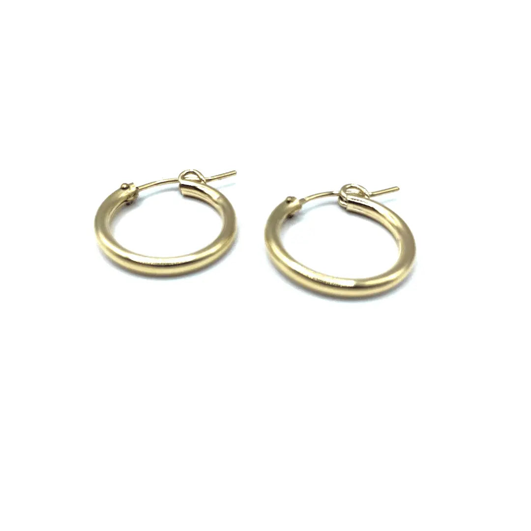 Gold filled Laguna 18mm hoop earring by erin gray, showcasing a sleek, rounded jewelry design with a shiny gold finish.