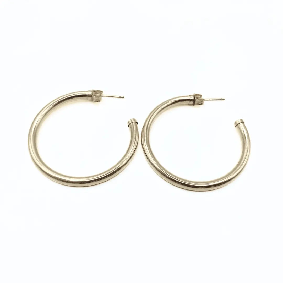 14K gold-filled Paris 42mm post hoop earrings by erin gray, waterproof jewelry with sleek, polished gold finish.