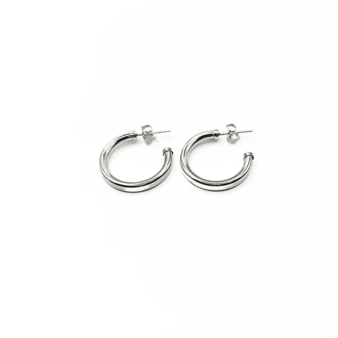 Sterling silver Paris post hoop earrings by erin gray, 20mm diameter, featuring smooth round hoops with secure post backs.