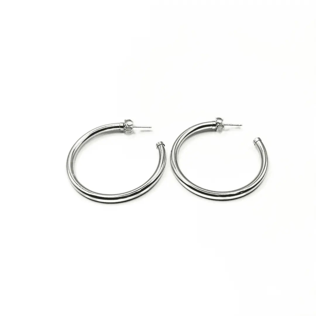 Sterling silver Paris post hoop earrings by erin gray, 42mm diameter, showcasing sleek, minimalist jewelry design.