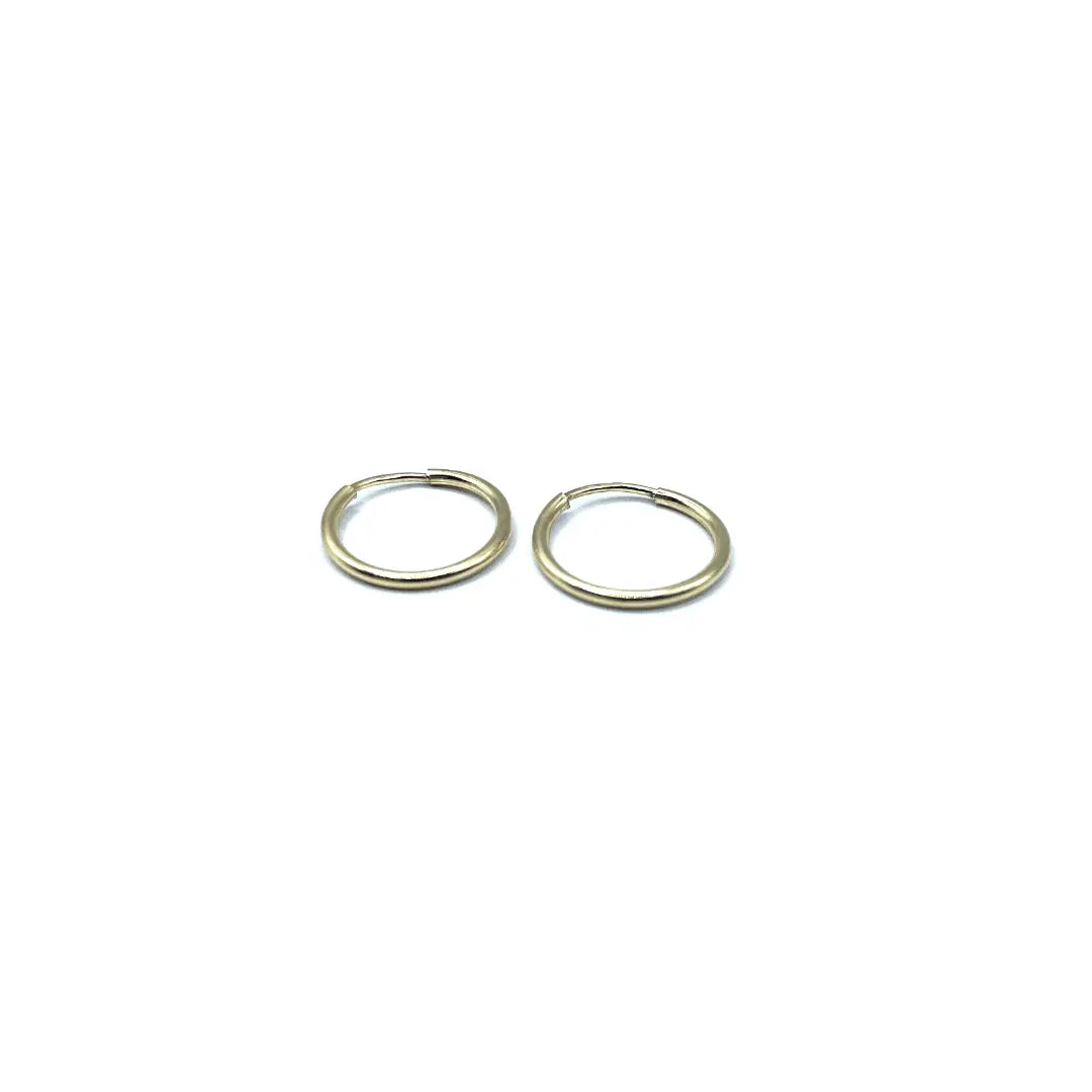 Small 14k gold-filled hoop earring by erin gray, showcasing a delicate jewelry design with a polished finish.