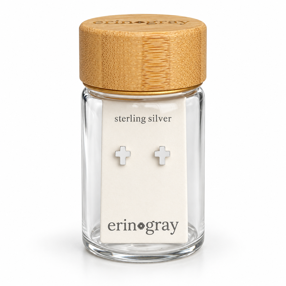 Tiny Cross Stud Earring in Sterling Silver in erin gray bottle