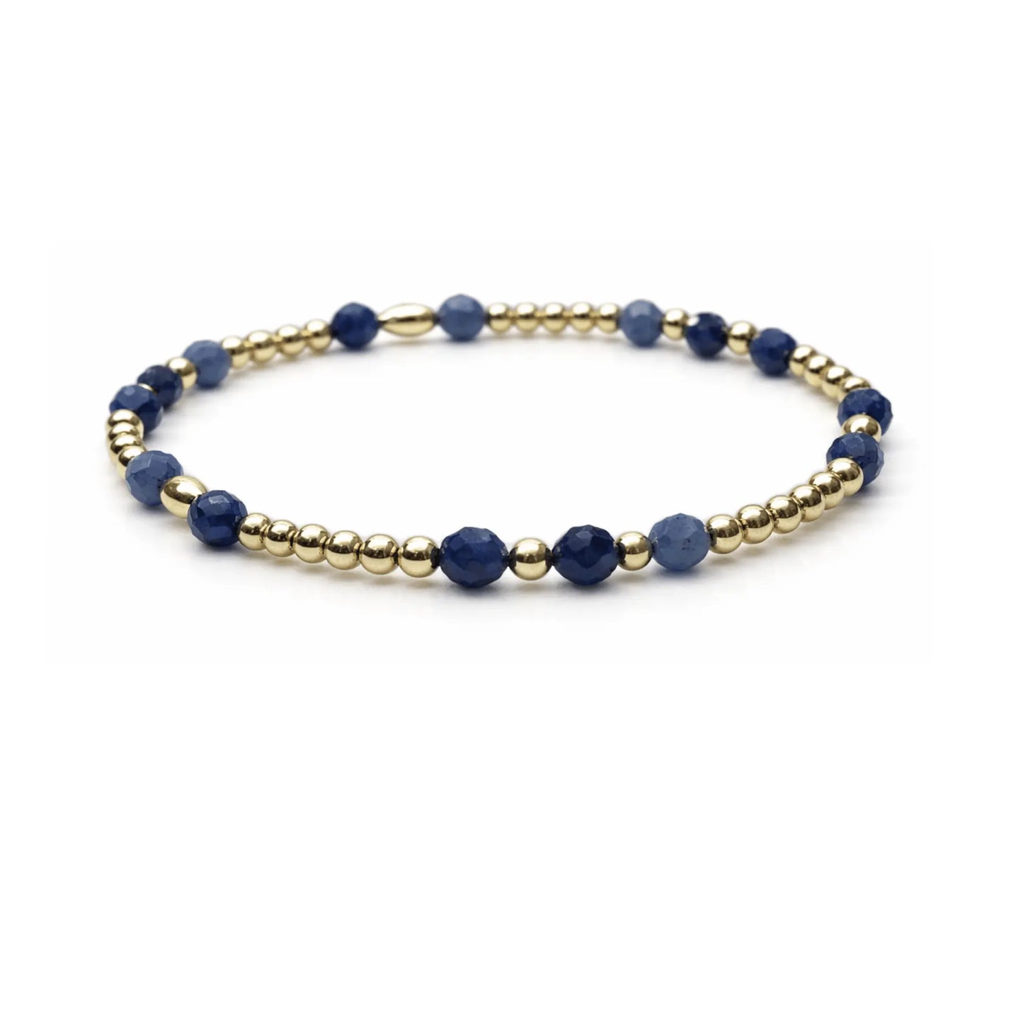 Beaded bracelet featuring blue sodalite stones and 14k gold-filled beads, showcasing a stylish waterproof jewelry design by Erin Gray.