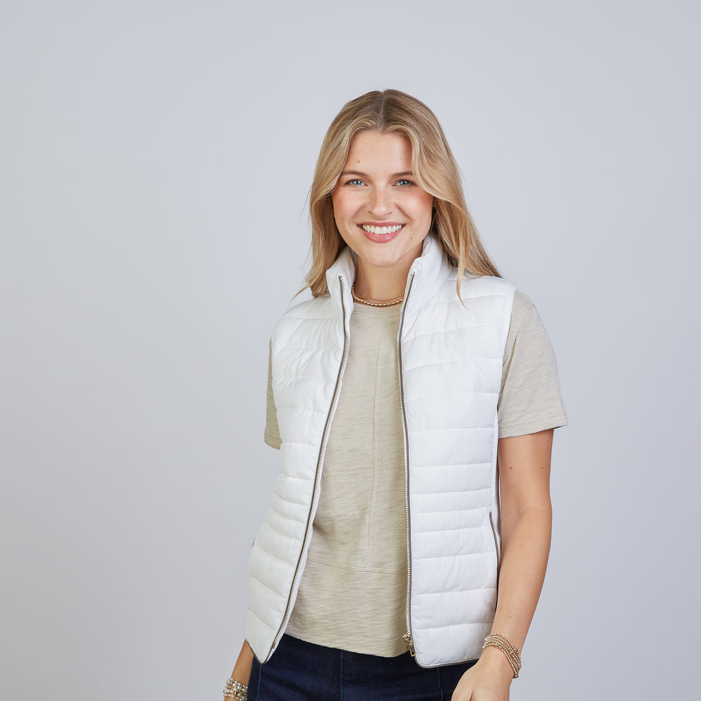 
                      
                        The Icon Perfect Fit Puffer Vest in Off-White & Brown
                      
                    