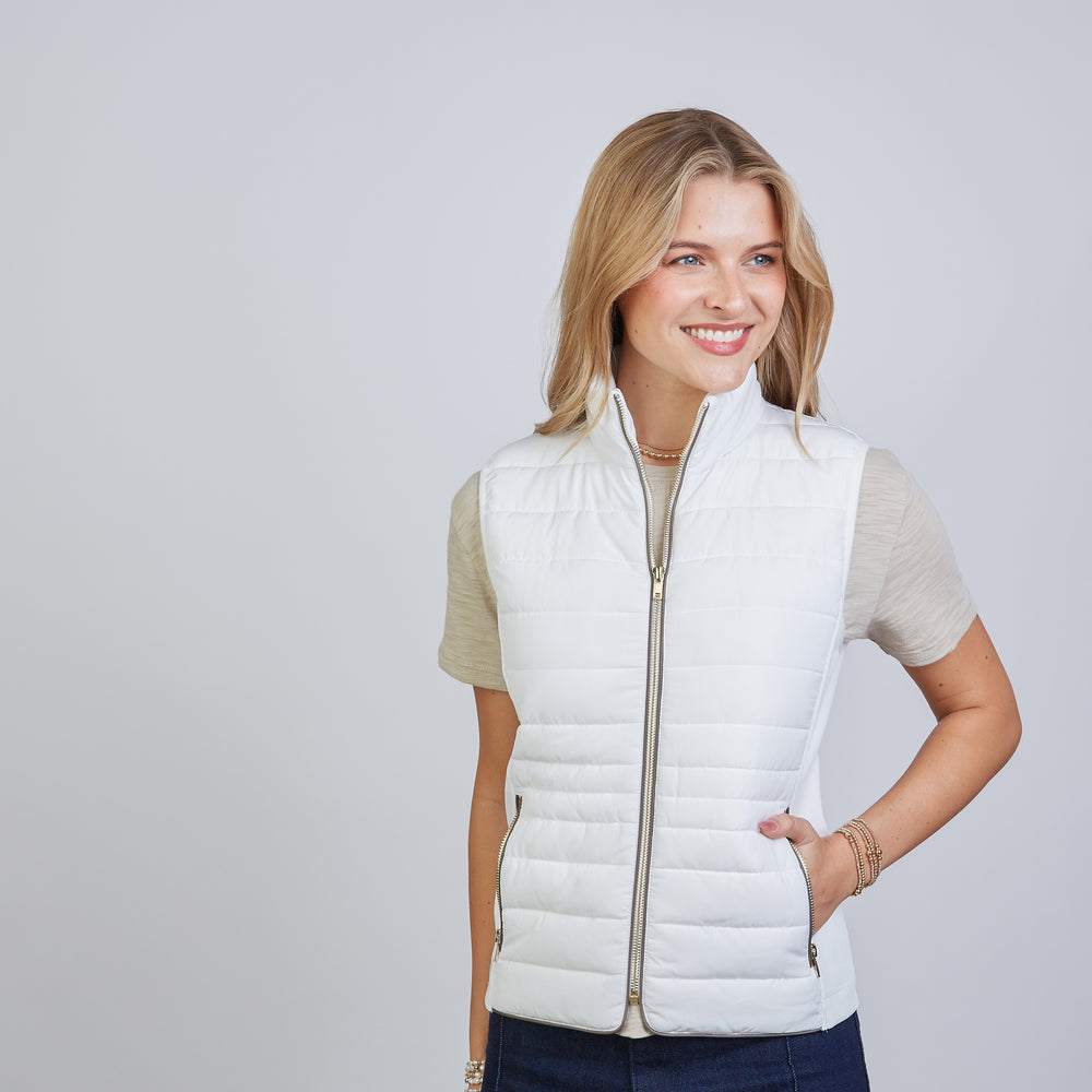 
                      
                        The Icon Perfect Fit Puffer Vest in Off-White & Brown
                      
                    