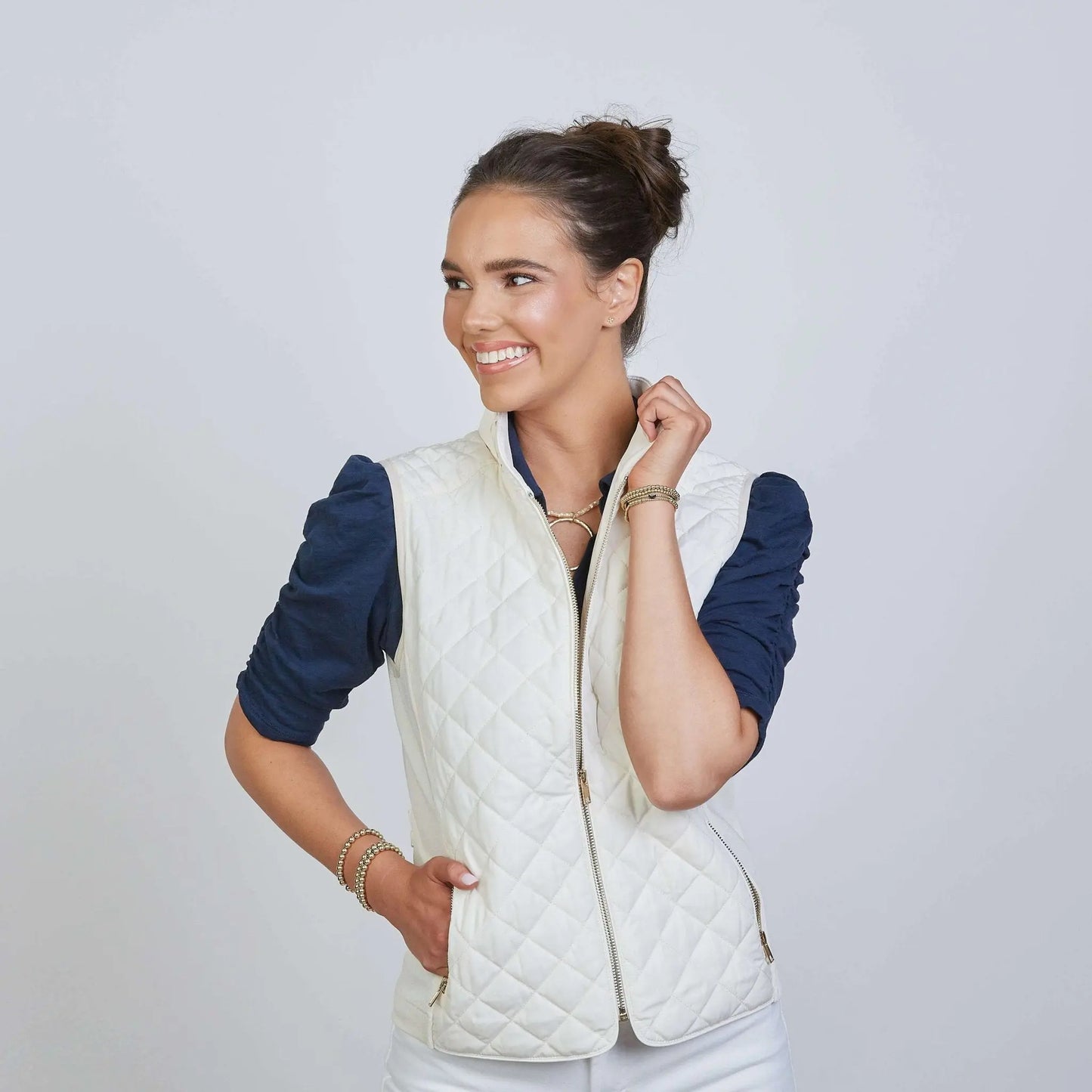 Ivory puffer vest from erin gray's Essential Perfect Fit collection, featuring a sleek, quilted design for stylish warmth.