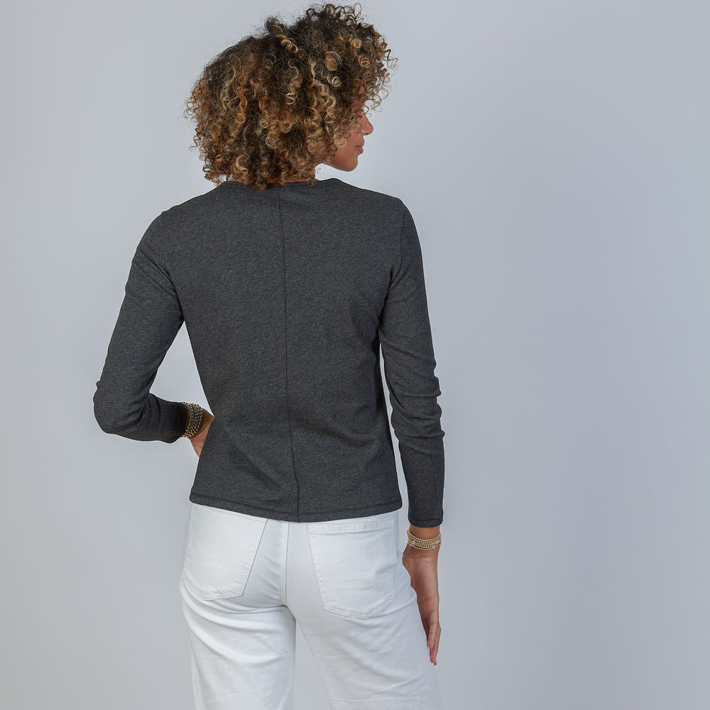 
                      
                        Woman wearing an erin gray dark heathered gray classic long-sleeve shirt and white pants against a light gray background
                      
                    