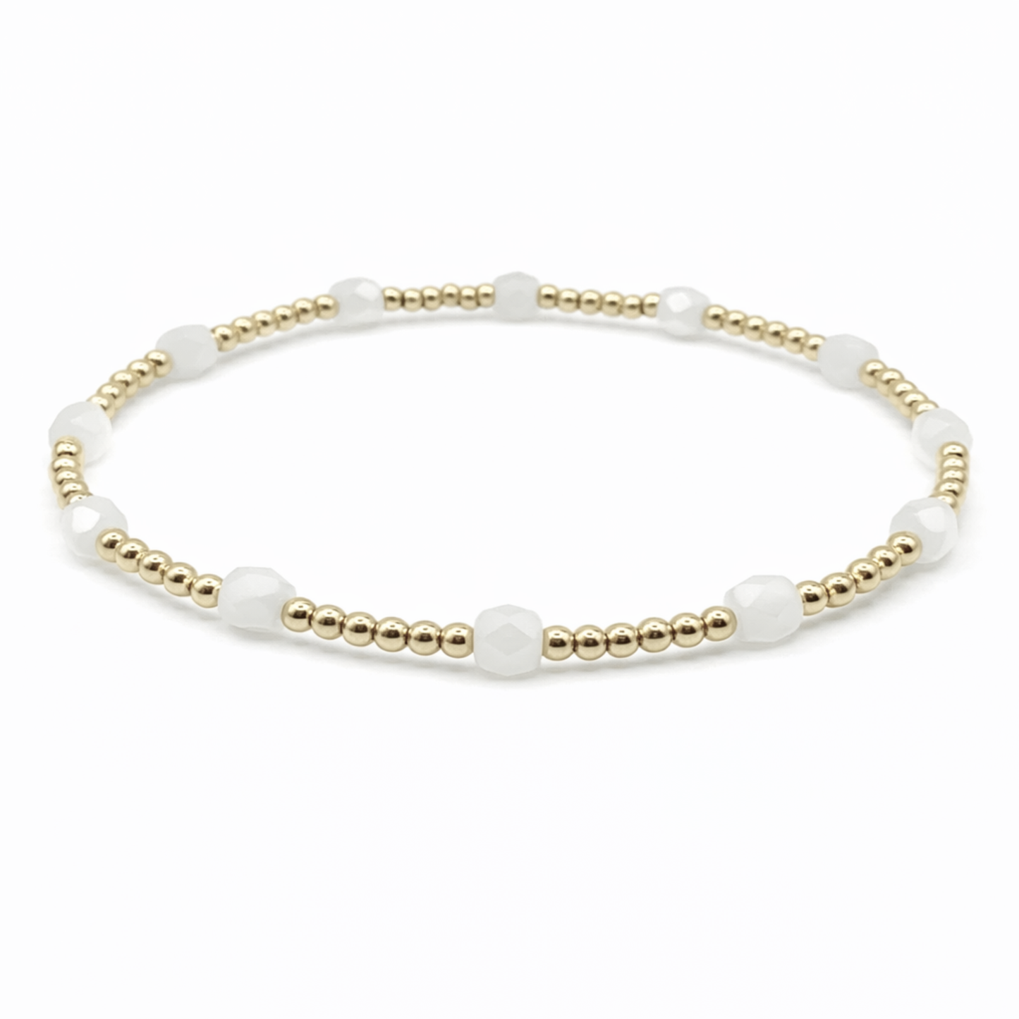 Bracelet with white beads and gold accents 